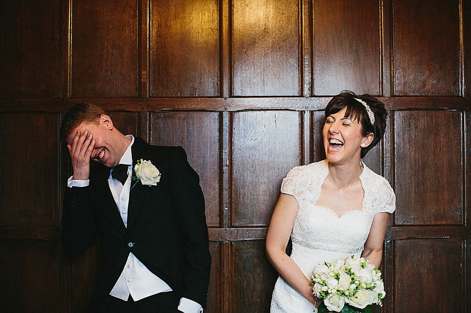bride and groom laughing at woodhall manor
