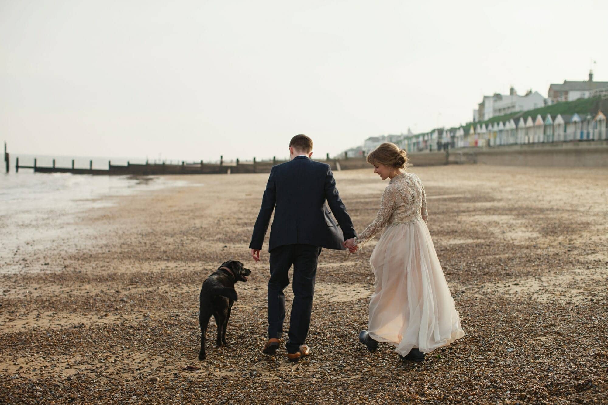 southwold beach wedding with bride and groom and dog