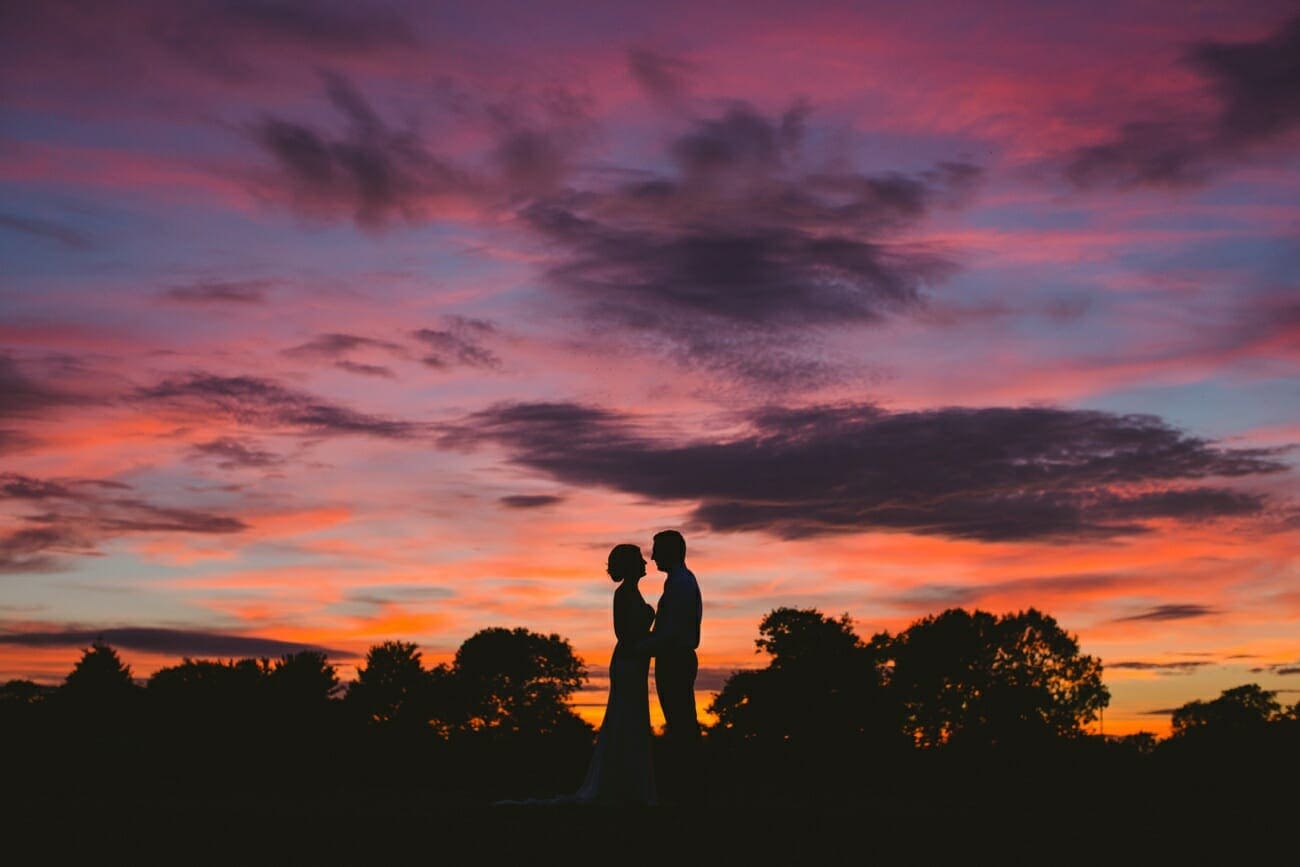 bride and groom at sunset in suffolk