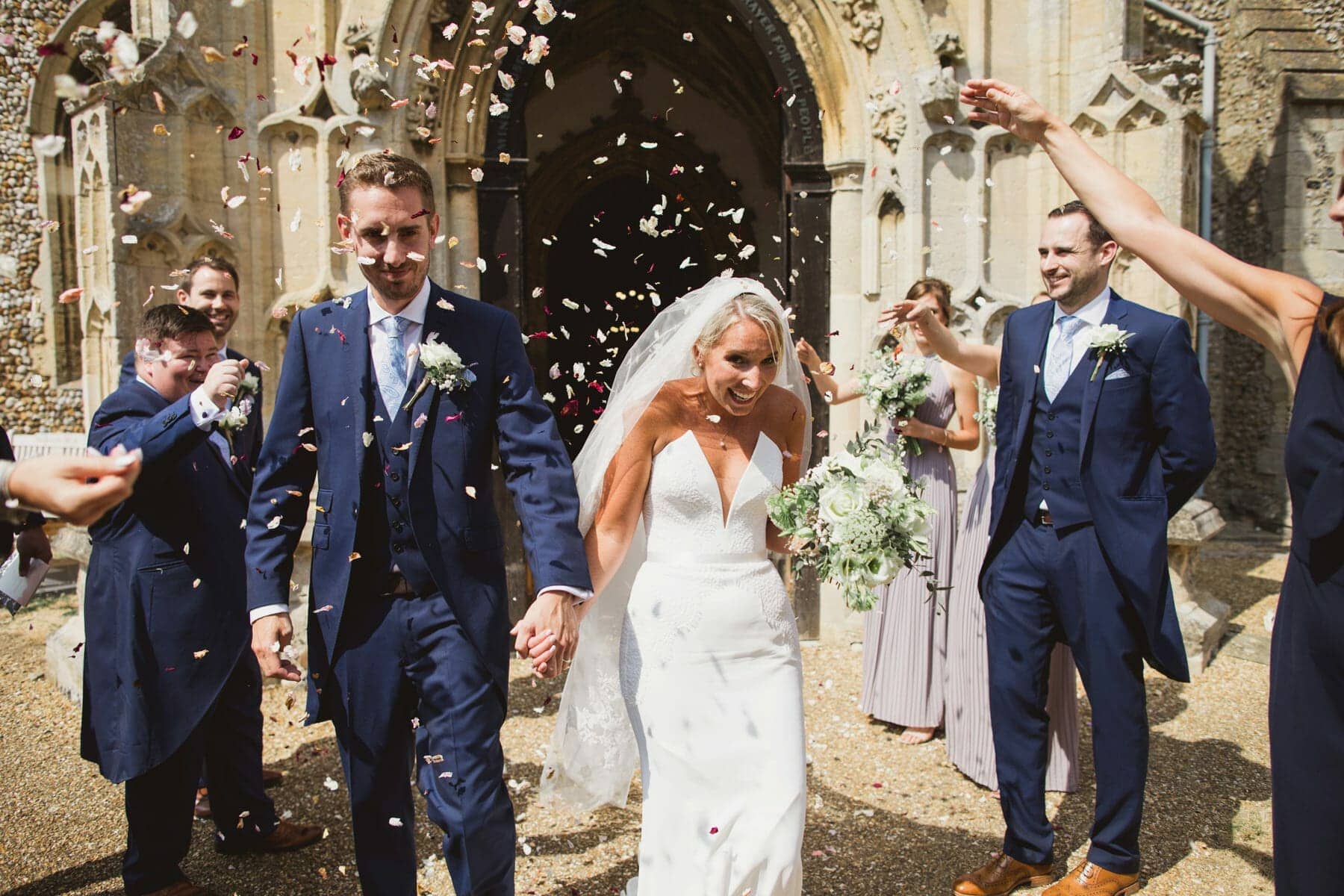 suffolk rustic and relaxed woolpit church wedding confetti shot