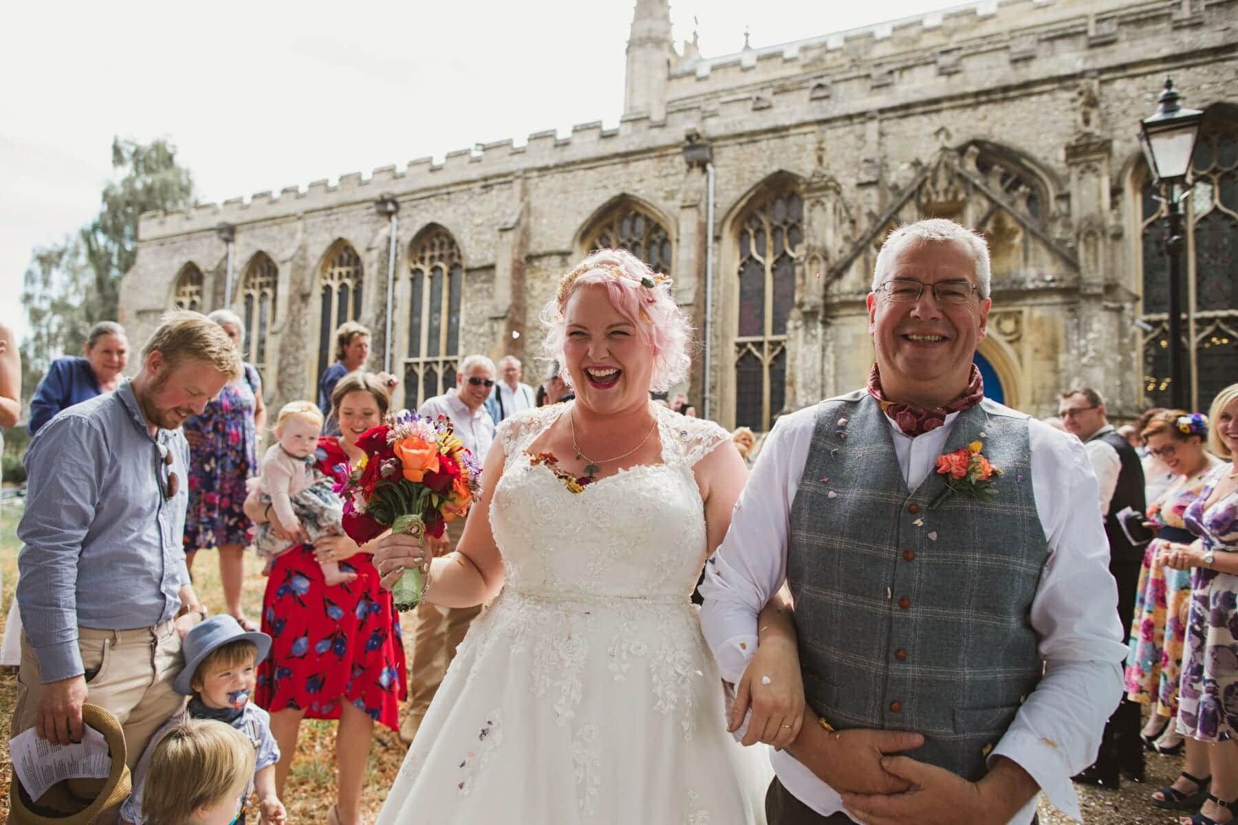 bride and groom leaving st edmunds cathedral through confetti
