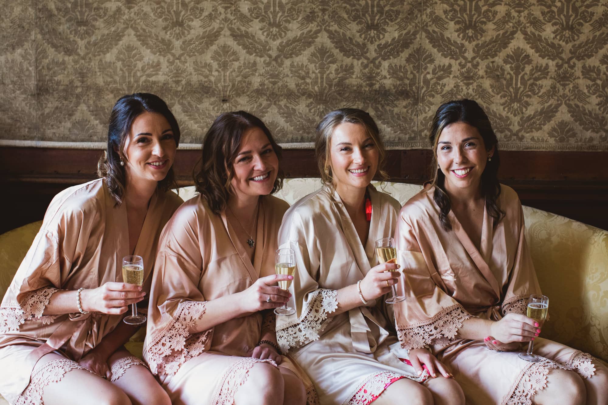bride and bridesmaids in matching dressing gowns