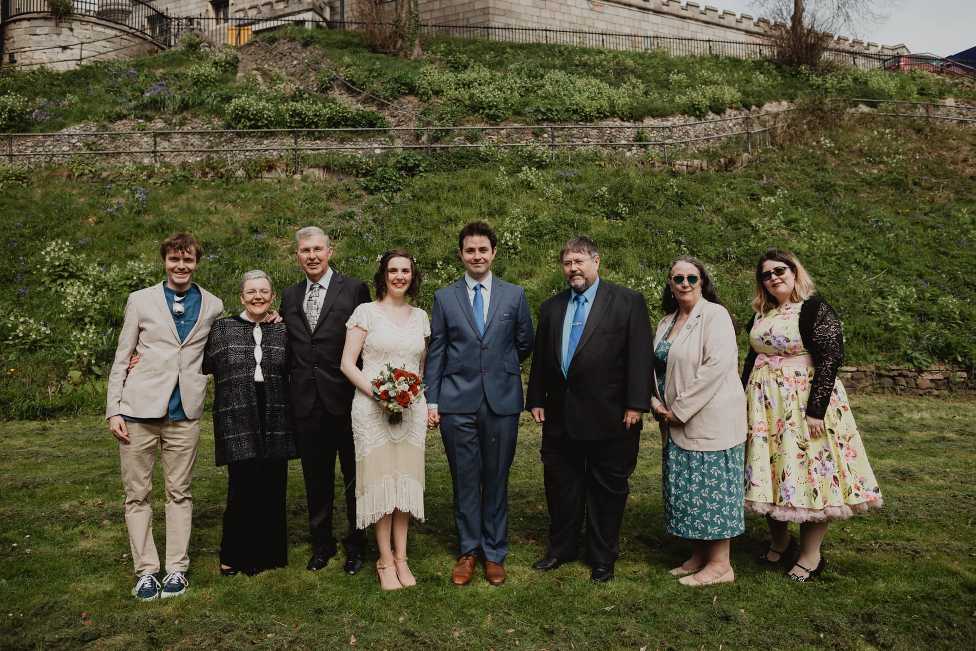 group photo of bride and groom and their family at norwich castle