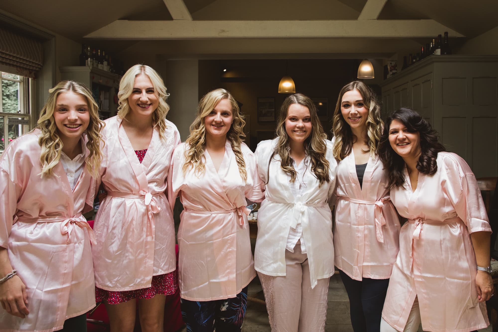 bride and bridesmaids in matching dressing gowns