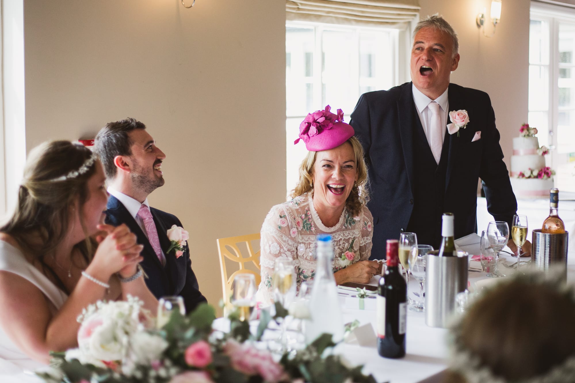 guests laughing at weddings speeches