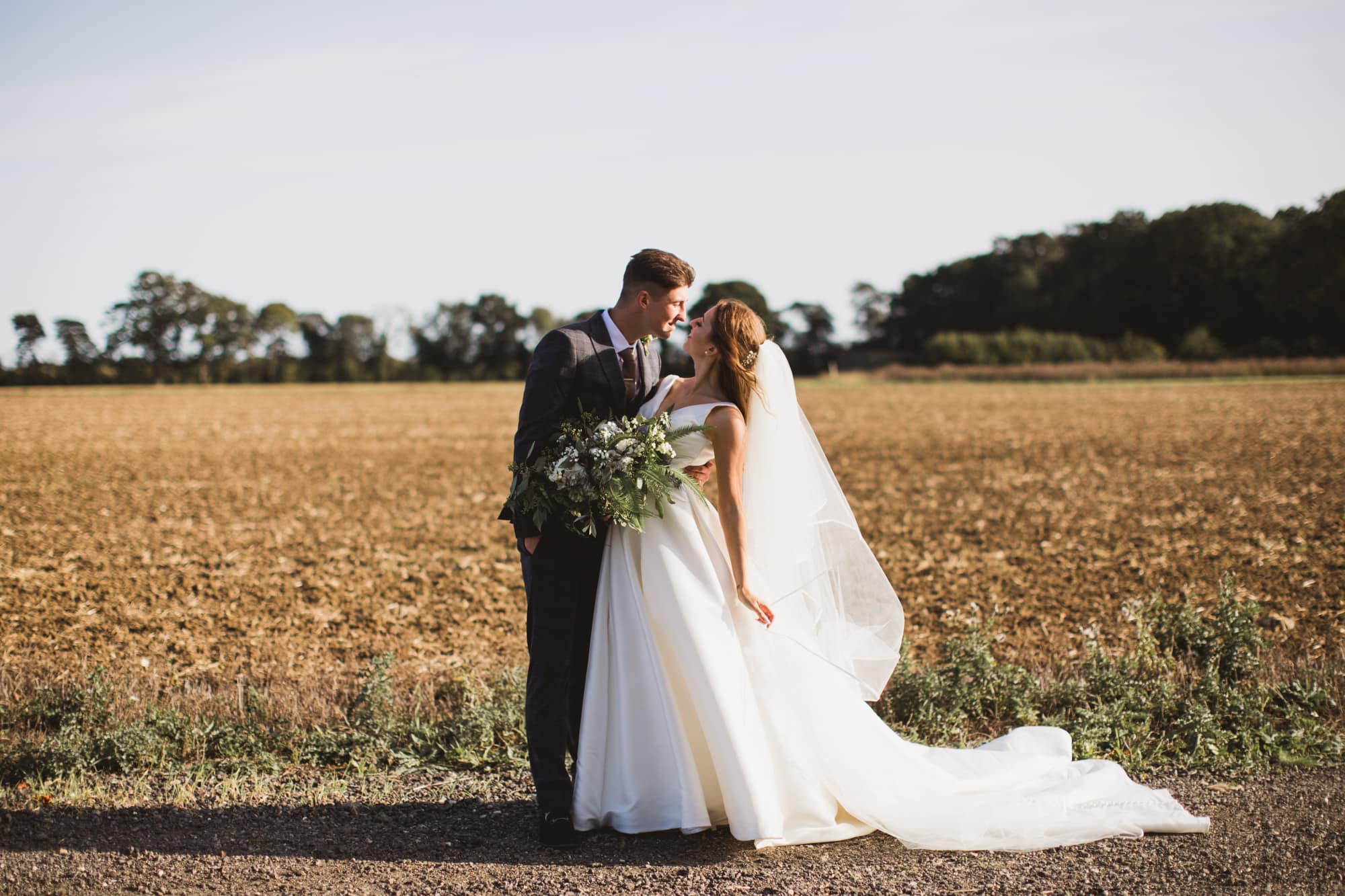 bride and groom at the granary estates in golden hour
