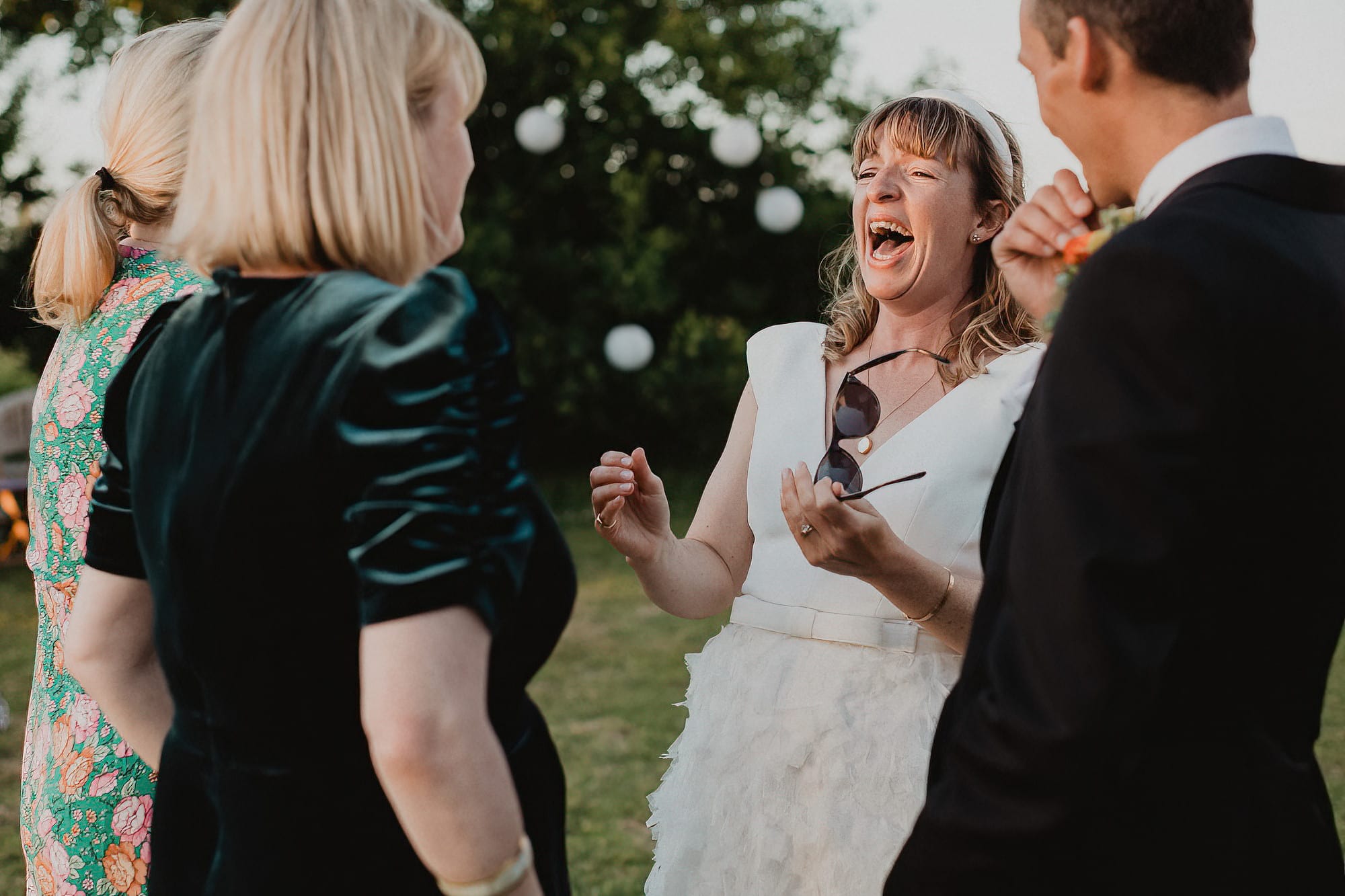 bride laughing with her guests