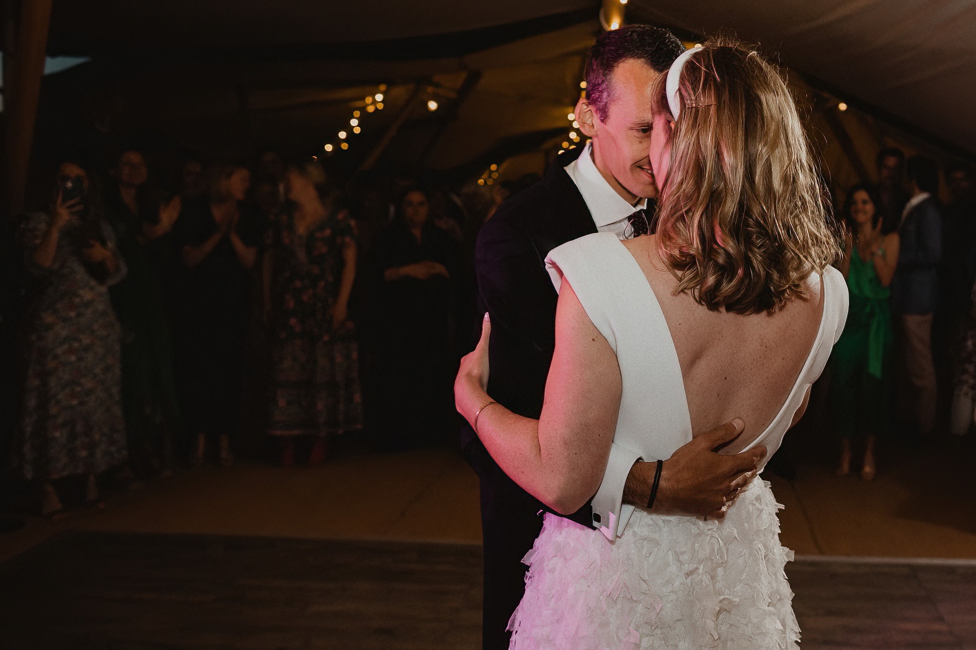bride and groom first dance in tipi wedding