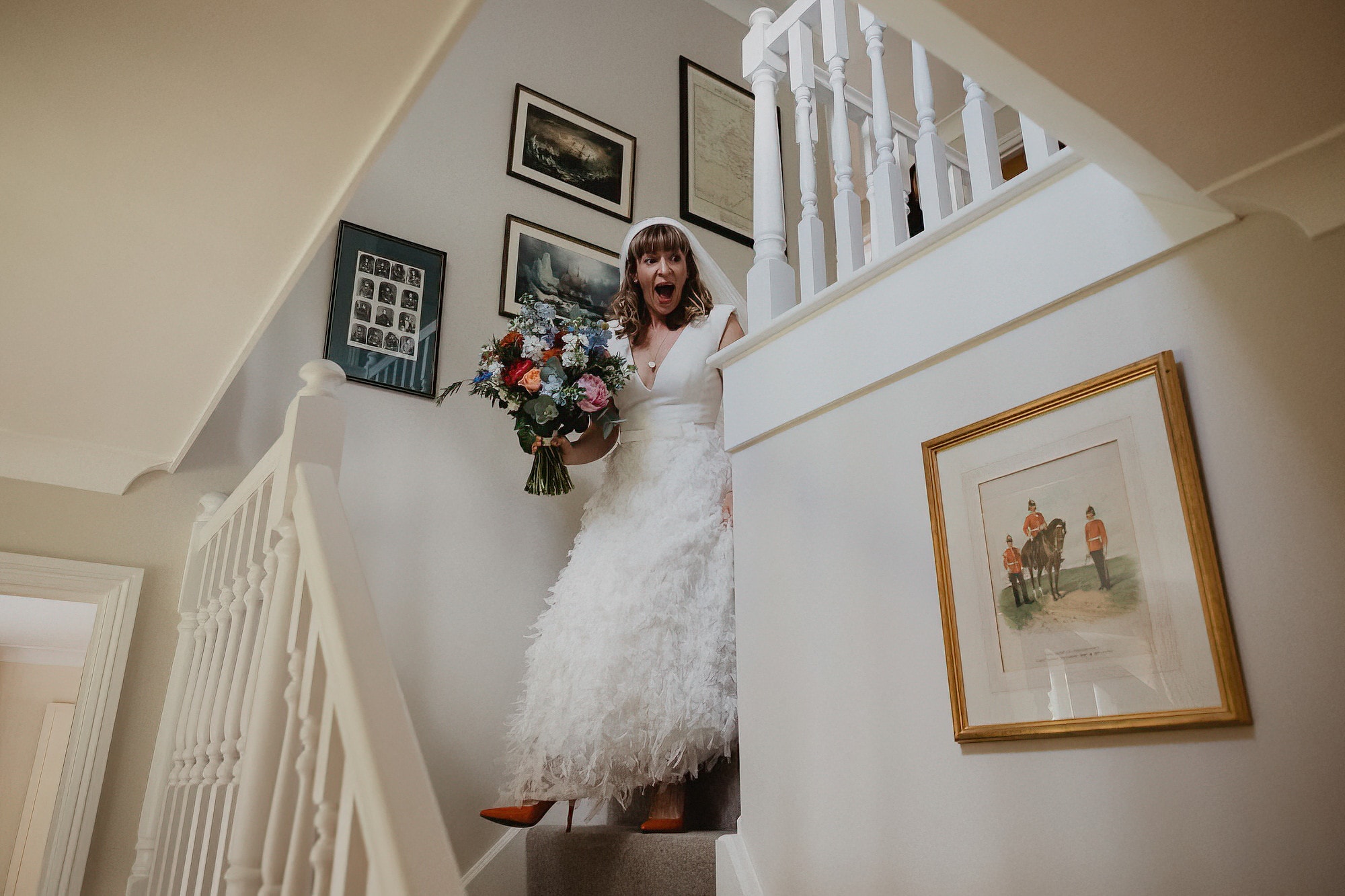 bride coming down the stairs making a grand entrance to mum
