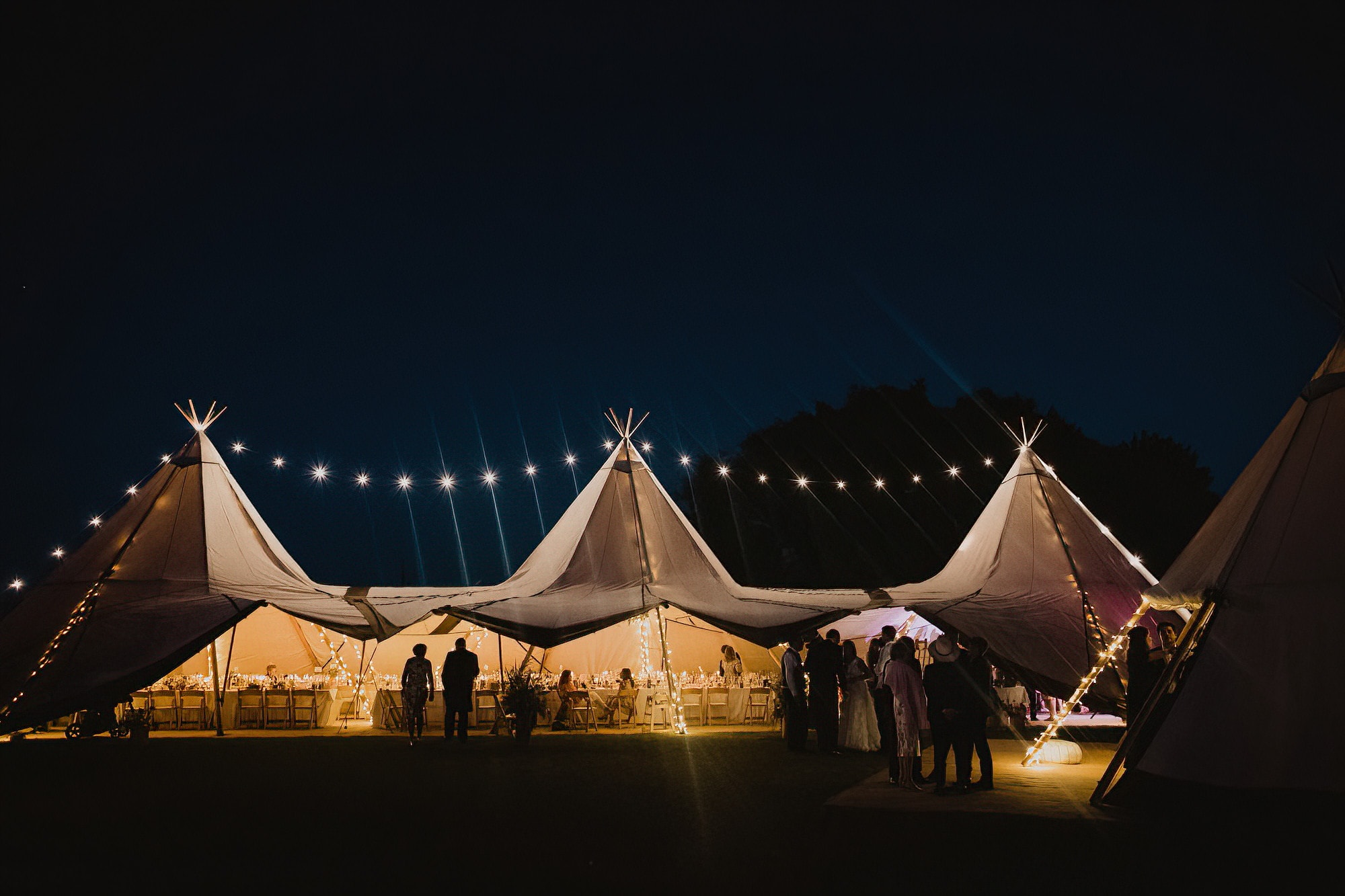 wedding tipi with pretty lights in the dark