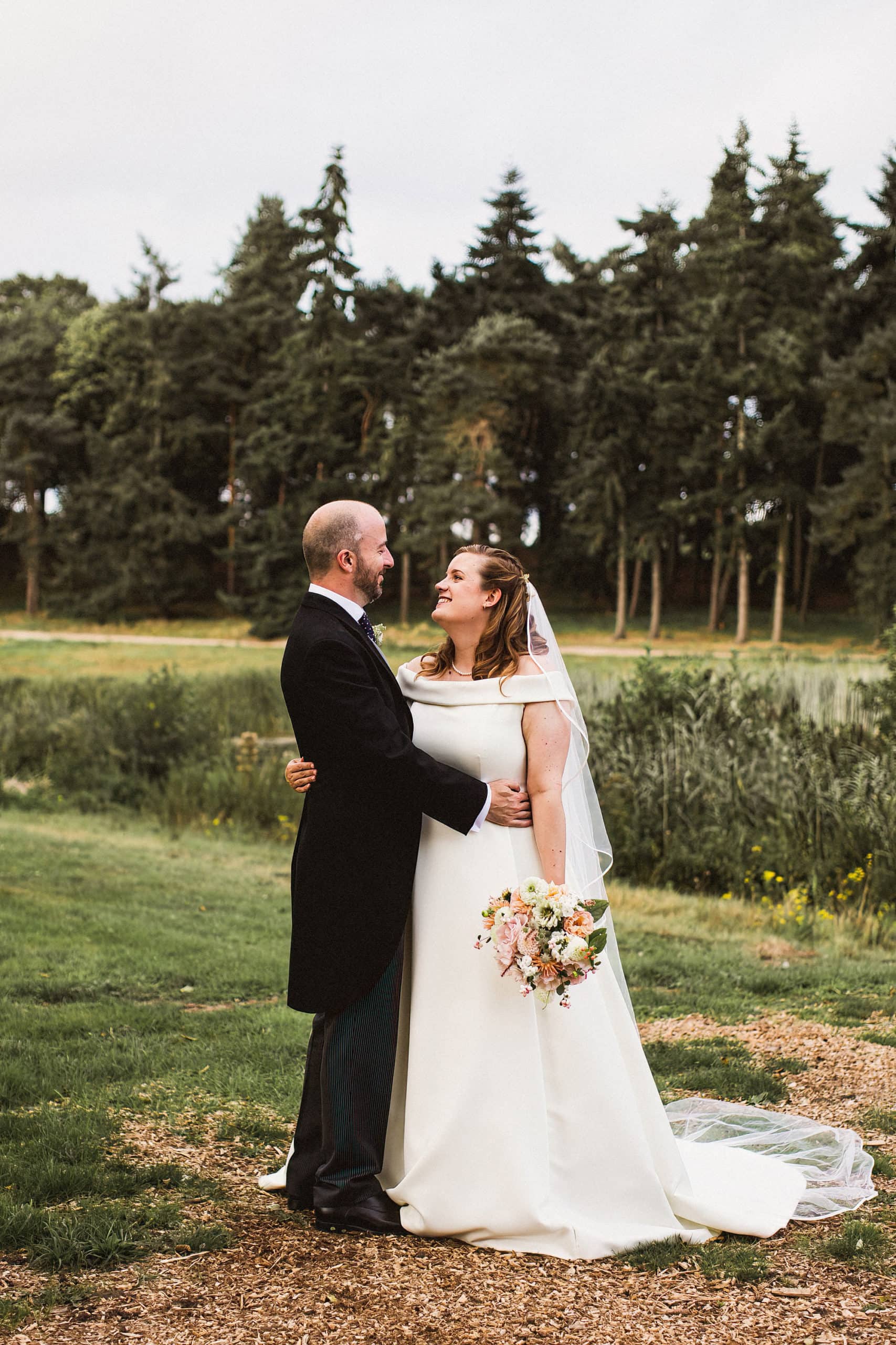 bride and groom in woodland at henham park