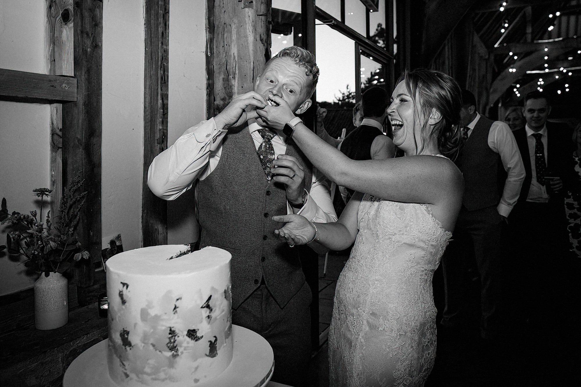 bride and groom eating wedding cake