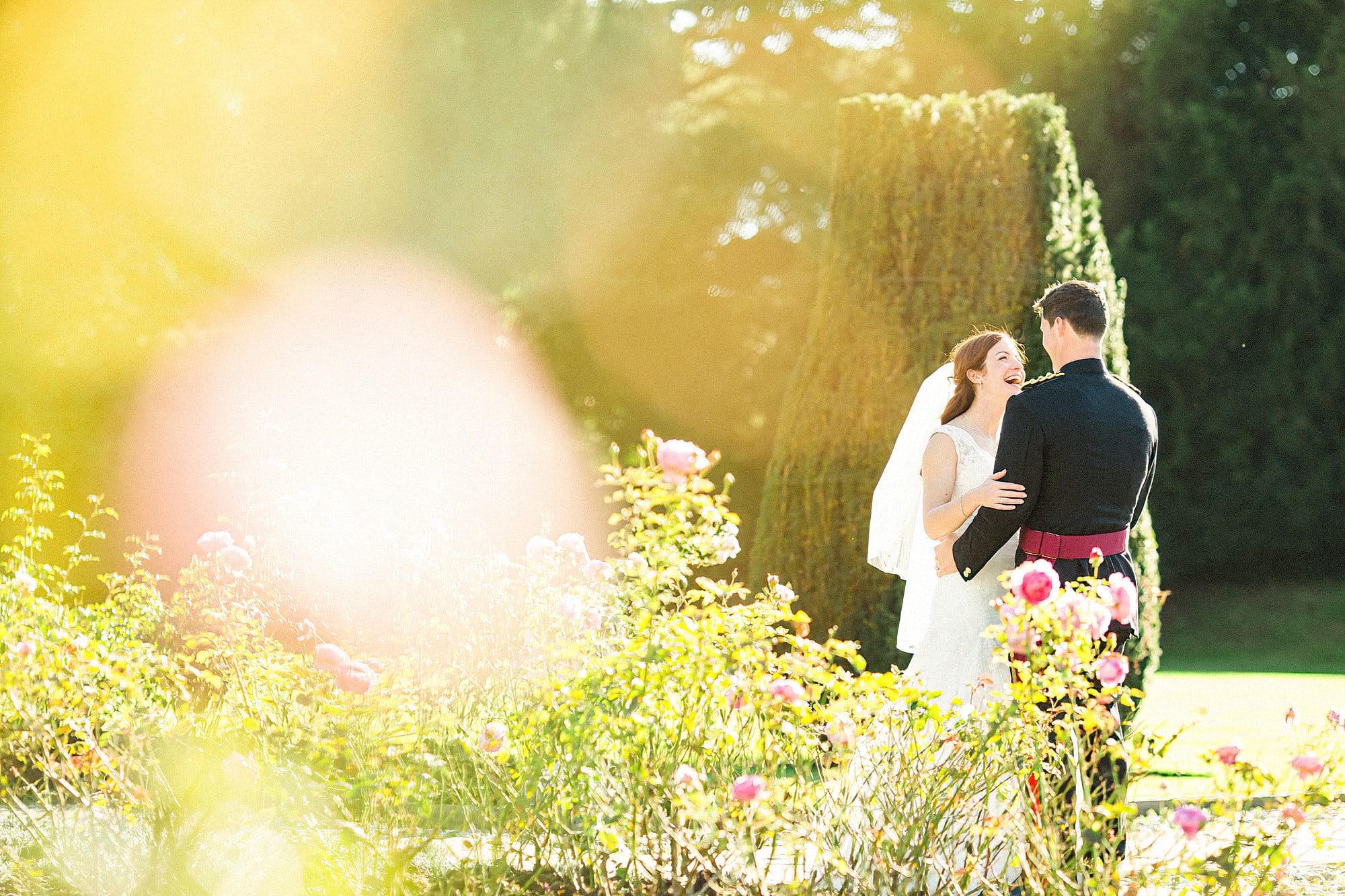 bride and groom in the grounds at hengrave hall