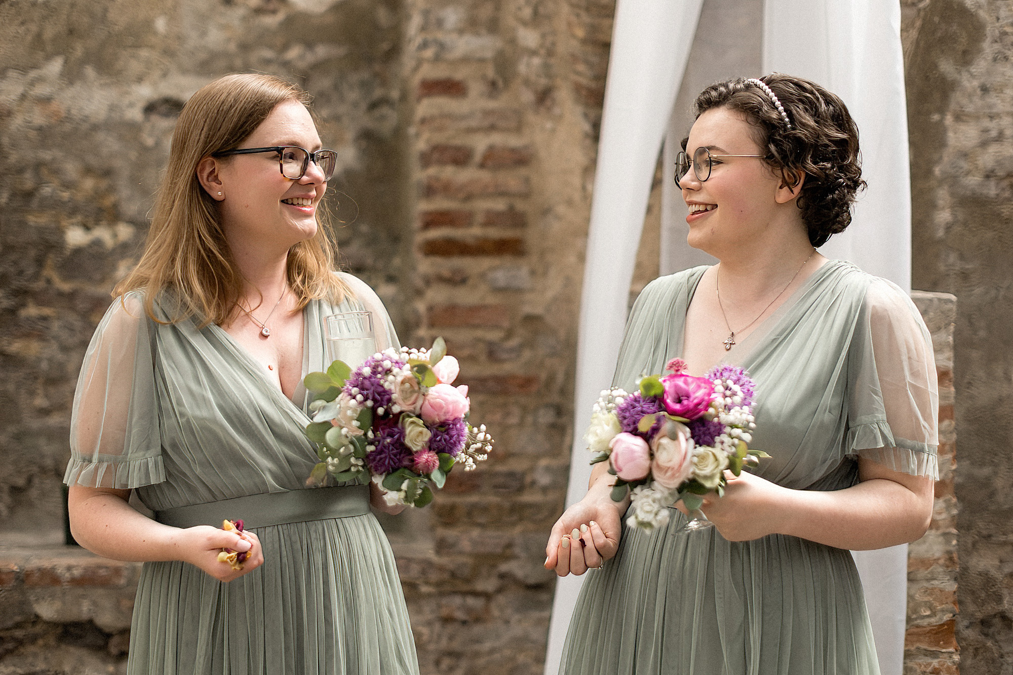 bridesmaids with handfulls of confetti the crypt the halls norwich